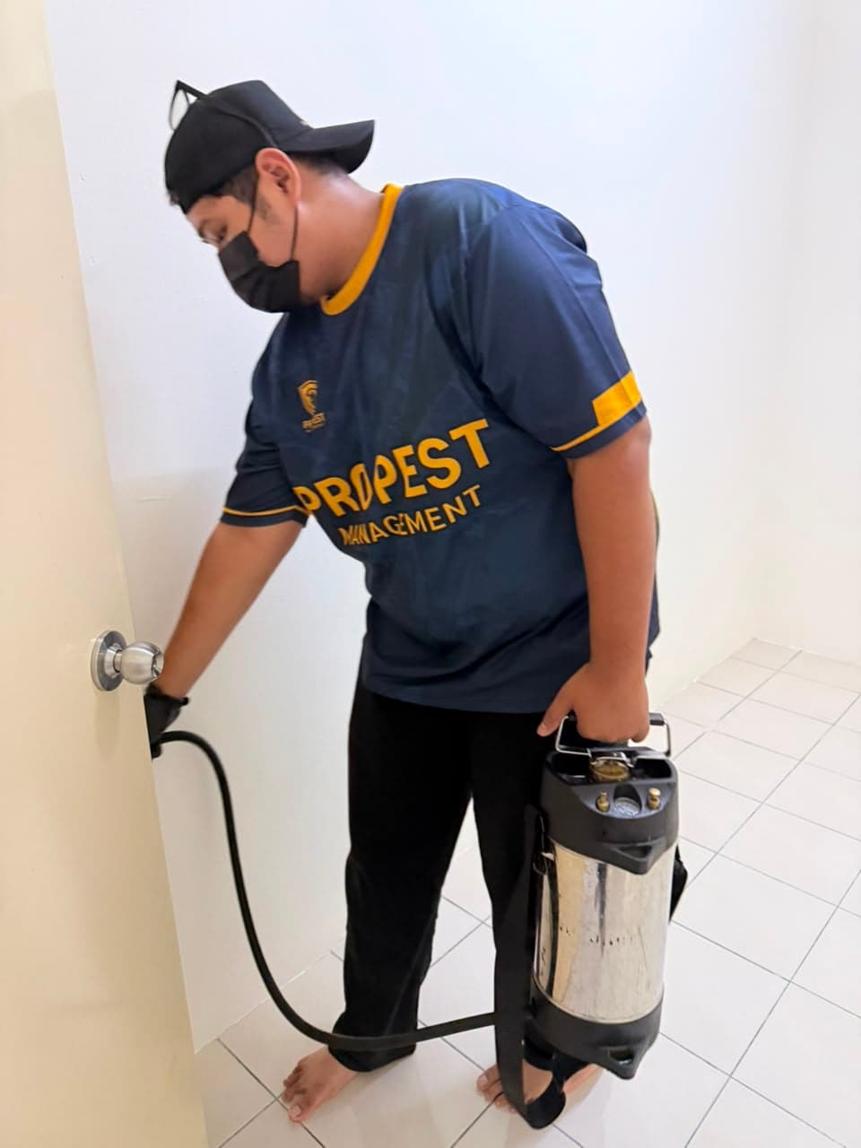 Pest control worker performing inspection